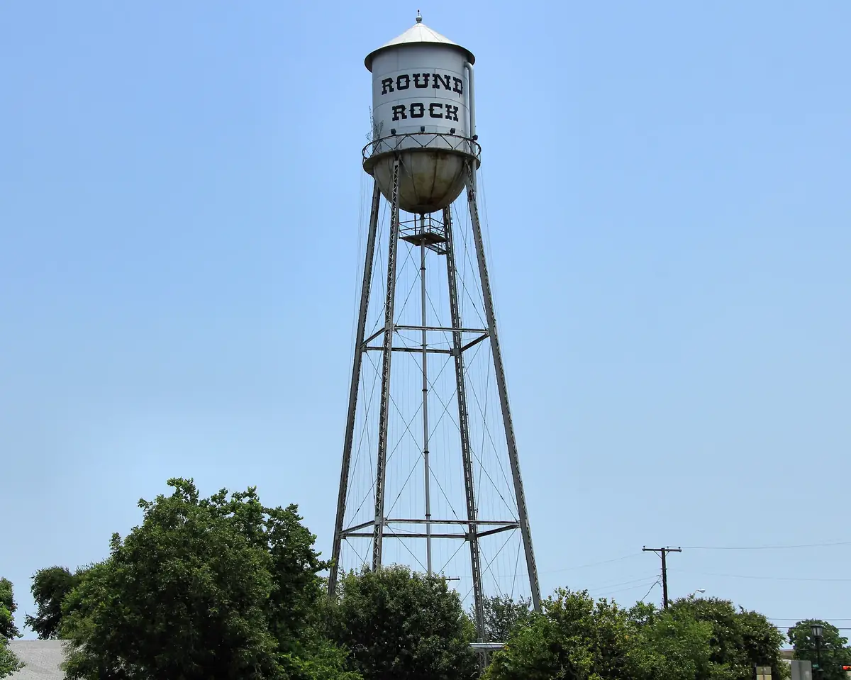 The historic Round Rock water tower with Round Rock painted on the tank